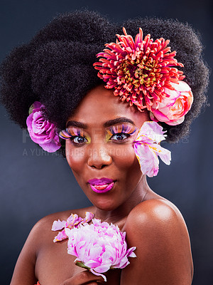 Buy stock photo Beauty, flowers and tongue with portrait of black woman in studio on dark background for natural cosmetics. Funny face, makeup and happy young model with protea in hair for aesthetic wellness at spa