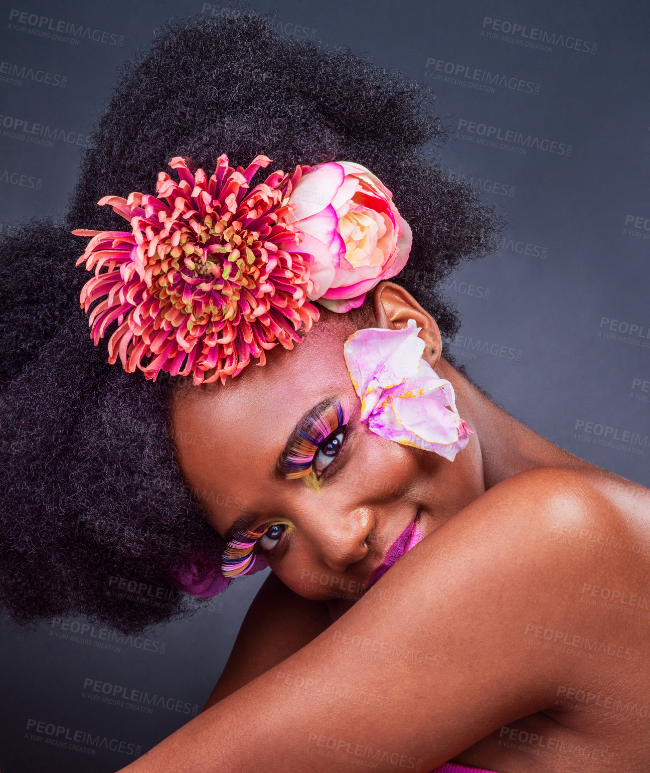 Buy stock photo Eyes, flowers and lashes with portrait of black woman in studio on dark background for natural cosmetics. Afro, beauty and face of young model with spring protea in hair for aesthetic wellness at spa