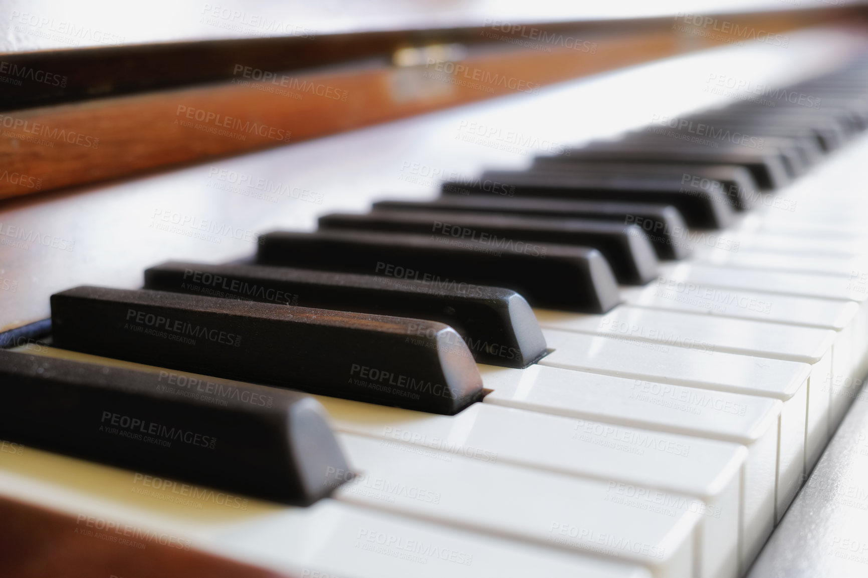 Buy stock photo Closeup of classic wooden piano keys on display at a musical art gallery. A vintage keyboard on used to compose classical music or songs. Detail of an old and antique instrument 