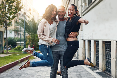 Buy stock photo Shot of three friends having fun while out in the city