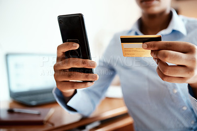 Buy stock photo Cropped shot of a businesswoman using a smartphone and credit card