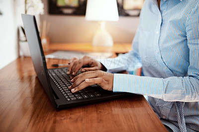 Buy stock photo Cropped shot of a businesswoman using a laptop at her desk