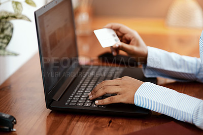 Buy stock photo Cropped shot of a businesswoman using a laptop and credit card