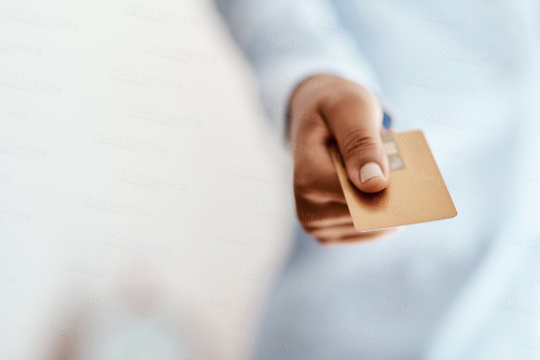 Buy stock photo Cropped shot of an unrecognizable businesswoman holding a credit card