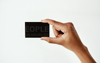 Buy stock photo Cropped studio shot of an unrecognizable woman holding a blank card