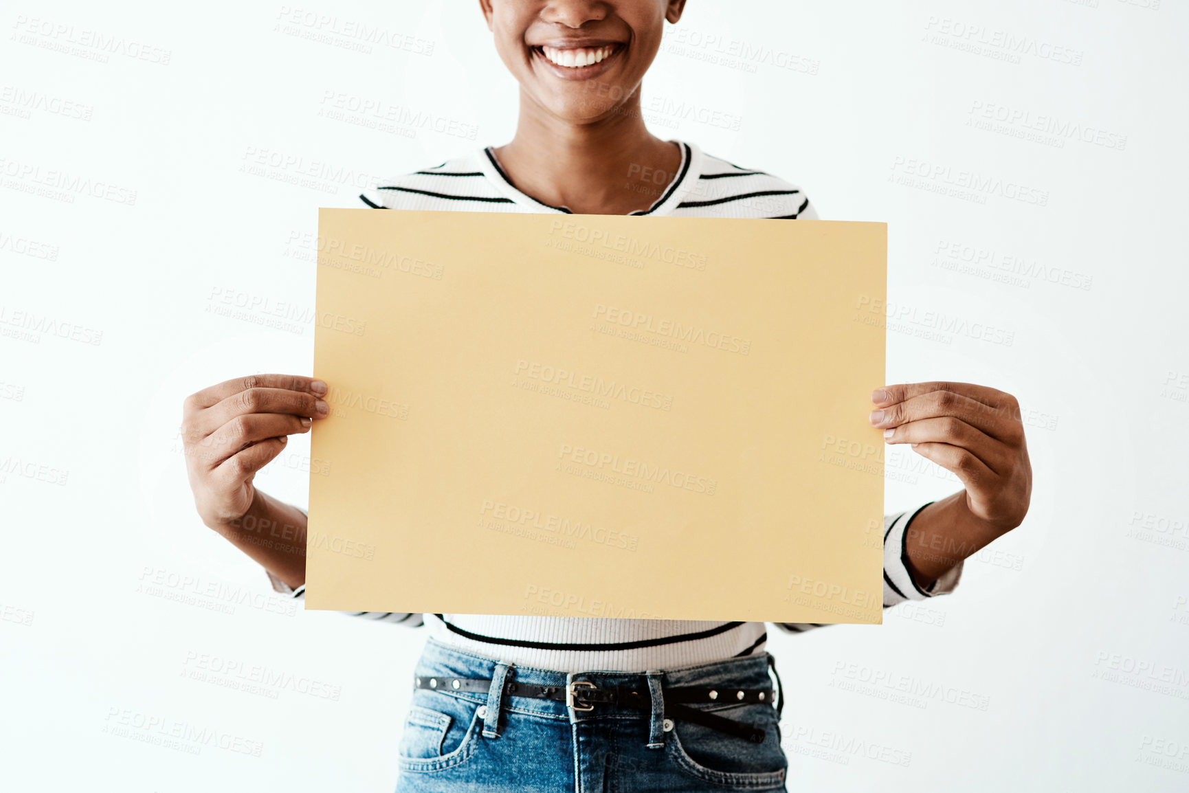 Buy stock photo Cropped studio shot of a woman holding a yellow poster against a white background