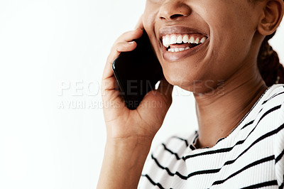 Buy stock photo Cropped shot of a woman using a smartphone against a white studio background