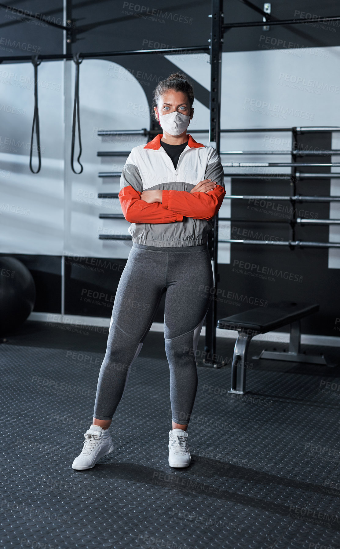 Buy stock photo Portrait of a young woman wearing a face mask in a gym
