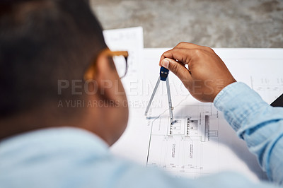 Buy stock photo Shot of an architect using a compass to draw a building plan
