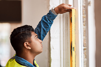 Buy stock photo Engineer, man and measure with bubble level at construction site, renovation and maintenance project. Architect, spirit and check building with tools for inspection or plumb surface by window frame