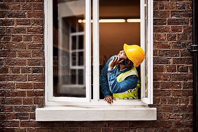 Buy stock photo Man, engineer and talk with phone call by window of inspection, building maintenance and schedule. Male person, mobile and and communication of development update, negotiation and renovation feedback