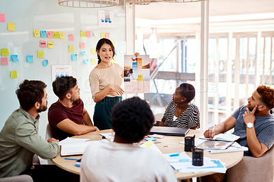 Buy stock photo Shot of a group of young creatives having a meeting in an office