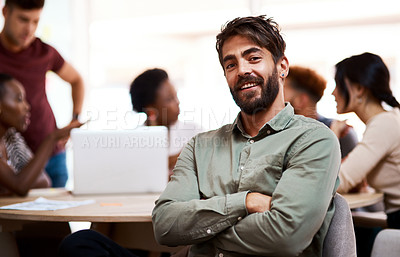 Buy stock photo Portrait of a confident young businessman sitting in an office