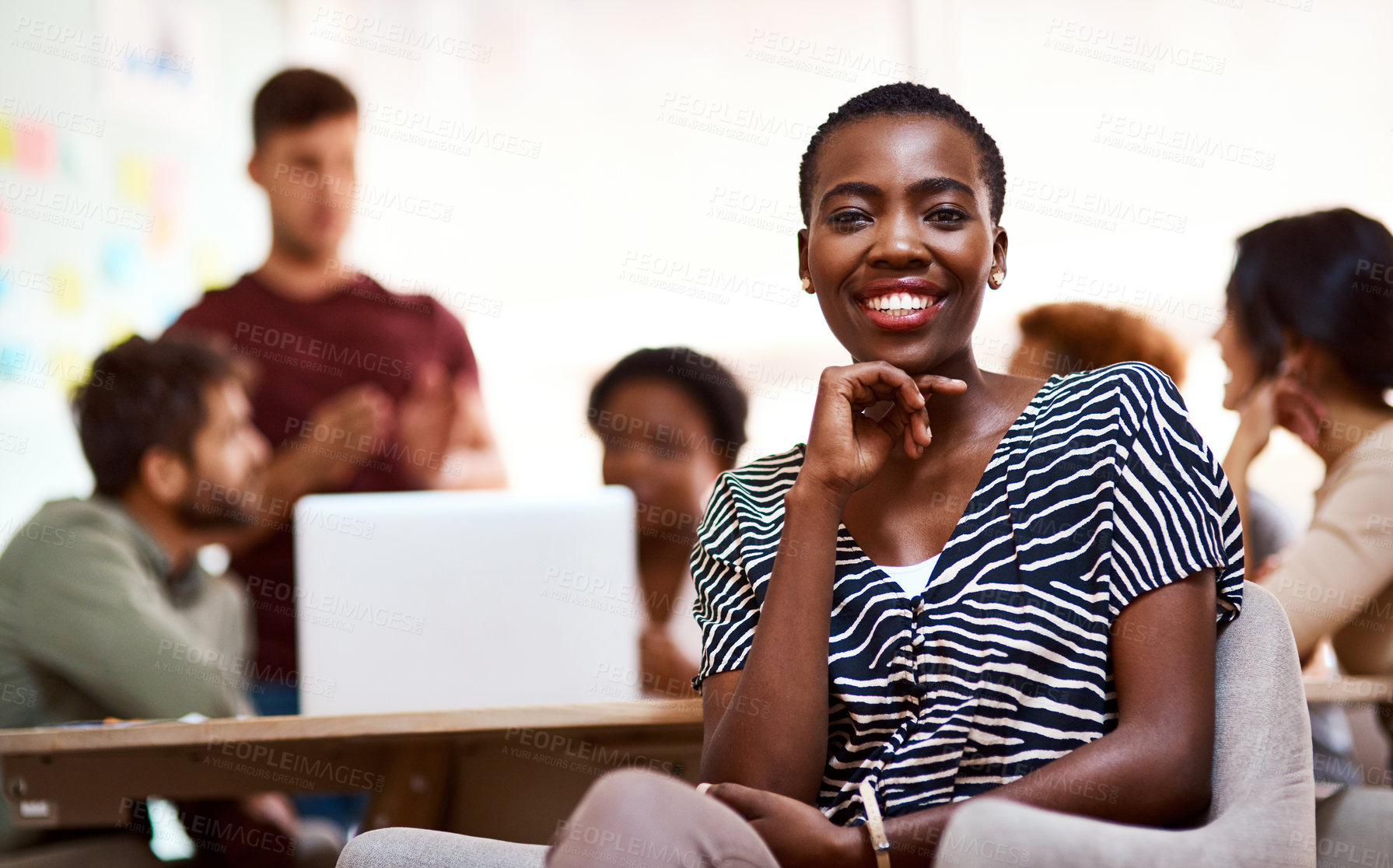 Buy stock photo Portrait of a confident young businesswoman sitting in an office