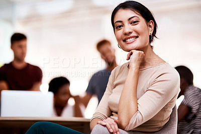 Buy stock photo Portrait of a confident young businesswoman sitting in an office