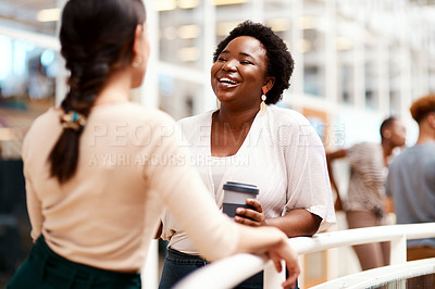 Buy stock photo Shot of a young businesswoman having a discussion with a colleague in an office