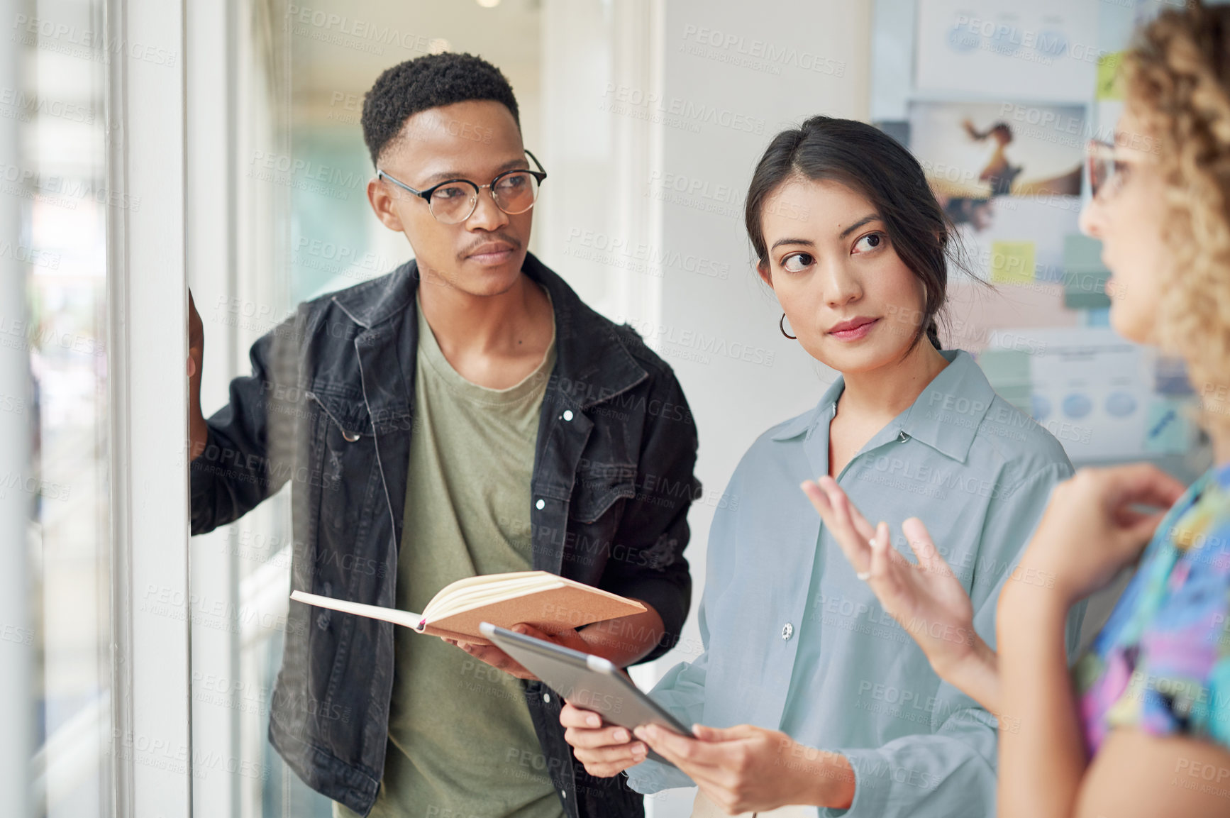 Buy stock photo Creative, discussion and group of business people at moodboard with collaboration, brainstorming and notes. Discussion, workshop and design team in office with tablet, growth and startup development