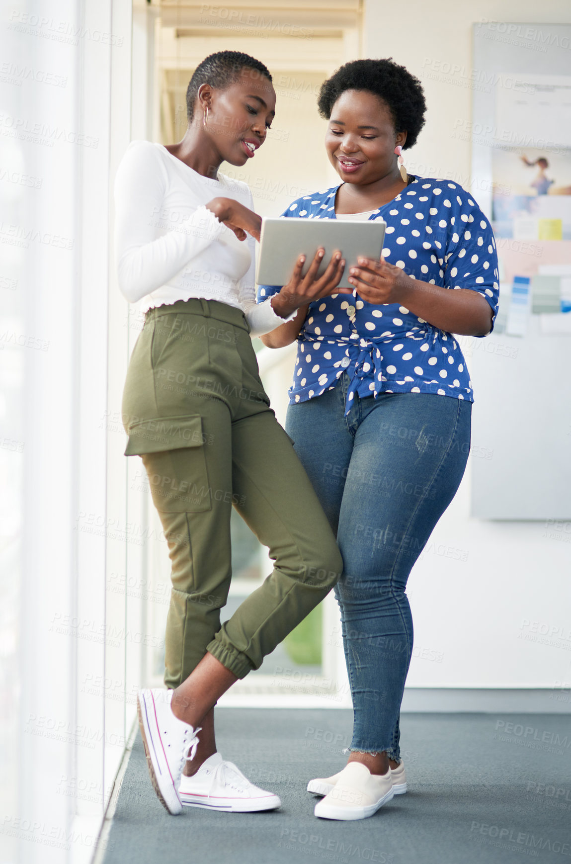 Buy stock photo Creative, discussion and African business women with tablet, smile and collaboration for online schedule. Advice, planning and design team on digital app together for web ideas on startup development