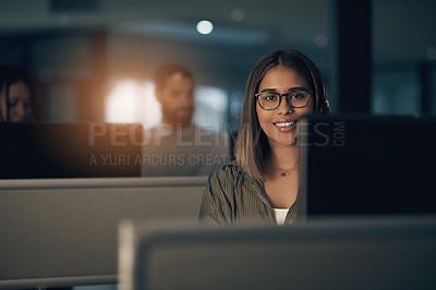 Buy stock photo Portrait of a call centre agent working in an office at night