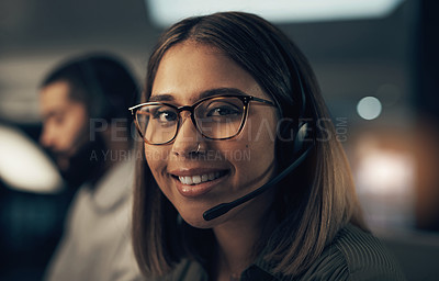 Buy stock photo Portrait of a call centre agent working in an office at night