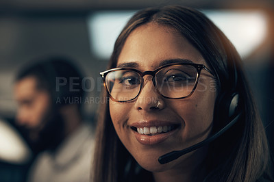 Buy stock photo Portrait of a call centre agent working in an office at night