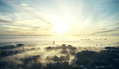 Buy stock photo City, sea and sunrise landscape with building skyline and ocean background in Cape Town. Fog, clouds and drone of sky with urban cityscape and sunlight outdoor in the morning by water and buildings