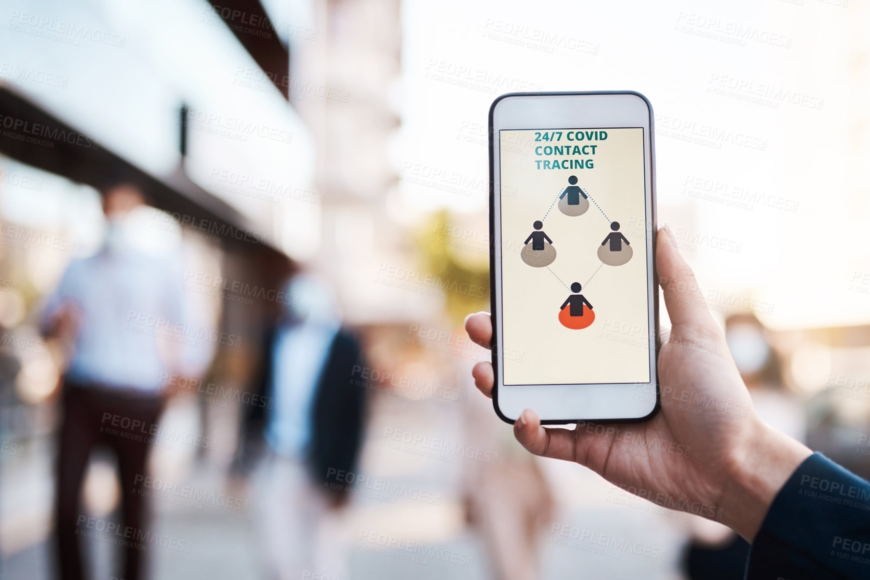 Buy stock photo Shot of an unrecognisable woman using a Covid-19 tracking app on her smartphone in the city