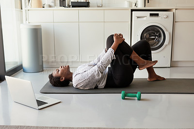 Buy stock photo Shot of a young woman exercising at home