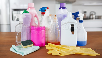 Buy stock photo Shot of various cleaning products on a table in the kitchen at home