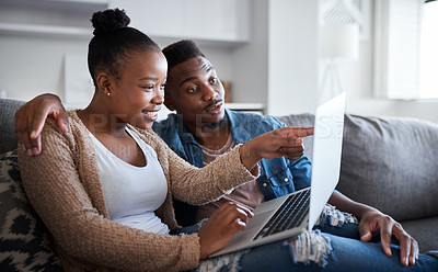 Buy stock photo Laptop, internet and news with a black couple together  in the living room of their home for entertainment or to relax. Social media, love and computer with a man and woman watching series or bonding
