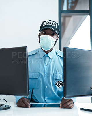 Buy stock photo Portrait of a confident masked young security guard on duty at the front desk of an office