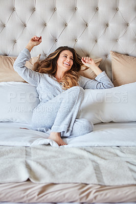 Buy stock photo Shot of a beautiful young woman waking up in bed feeling refreshed