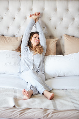 Buy stock photo Shot of a beautiful young woman waking up in bed feeling refreshed