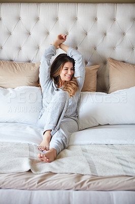 Buy stock photo Shot of a beautiful young woman waking up in bed feeling refreshed