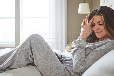 Buy stock photo Shot of a beautiful young woman spending a relaxing morning at home