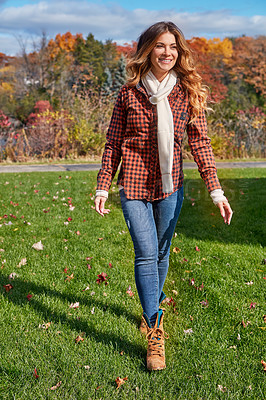 Buy stock photo Full length shot of an attractive young woman in the park during autumn