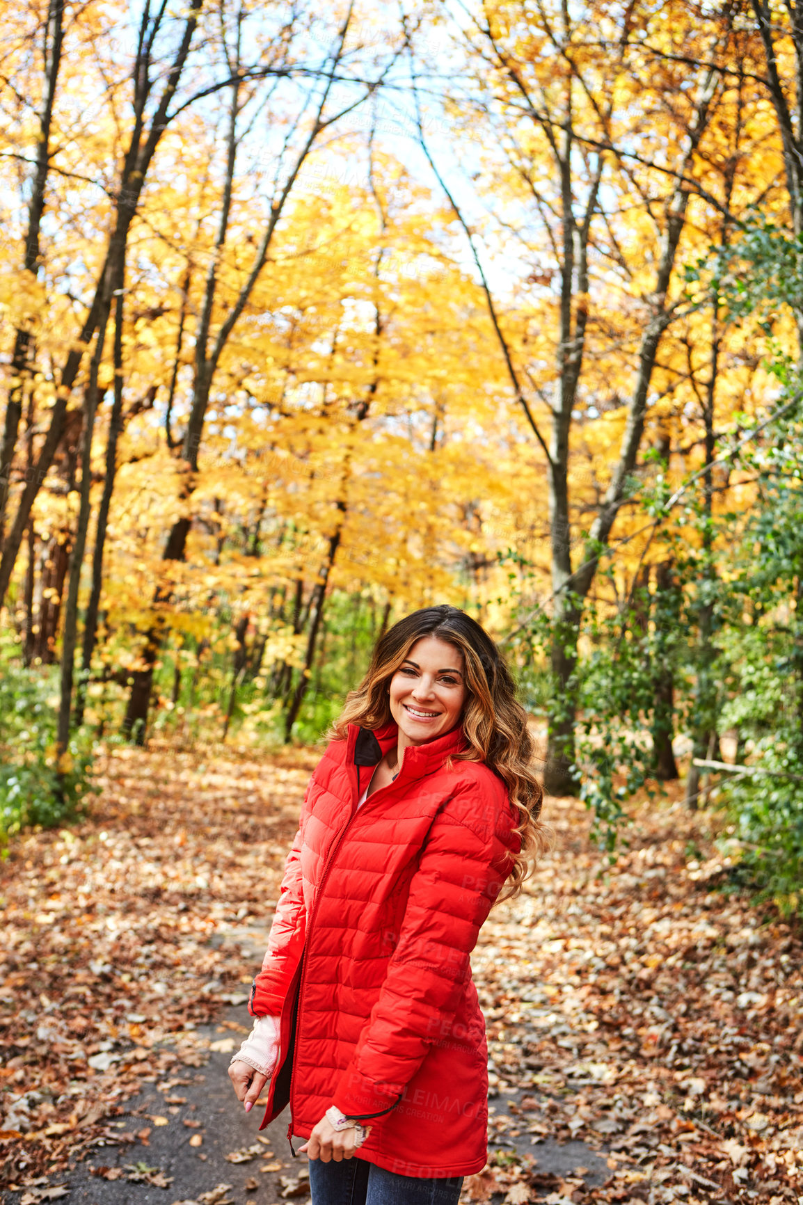 Buy stock photo Cropped portrait of an attractive young woman in the forest during autumn
