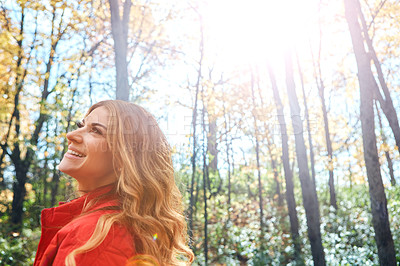 Buy stock photo Cropped shot of an attractive young woman in the forest during autumn