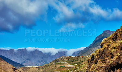 Buy stock photo The beautiful Island of La Palma, Canary islands in Spain in summer. Landscape copyspace view of mountains and hills for hiking and adventure abroad. Scenic natural environment against a blue sky