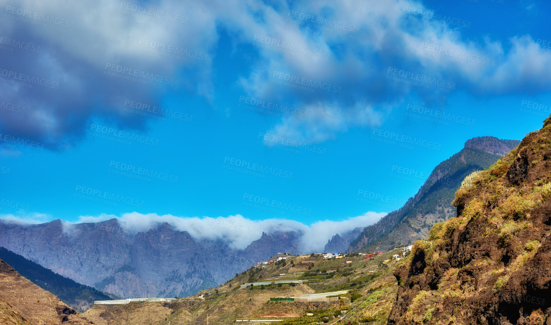 Buy stock photo The beautiful Island of La Palma, Canary islands in Spain in summer. Landscape copyspace view of mountains and hills for hiking and adventure abroad. Scenic natural environment against a blue sky