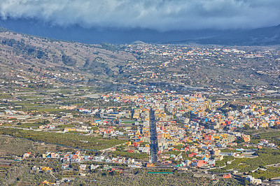 Buy stock photo Aerial view of the beautiful city of Los Llanos, La Palma, and the Canary Islands. A small vibrant town or urban village surrounded by lush green plants or nature on an overcast afternoon