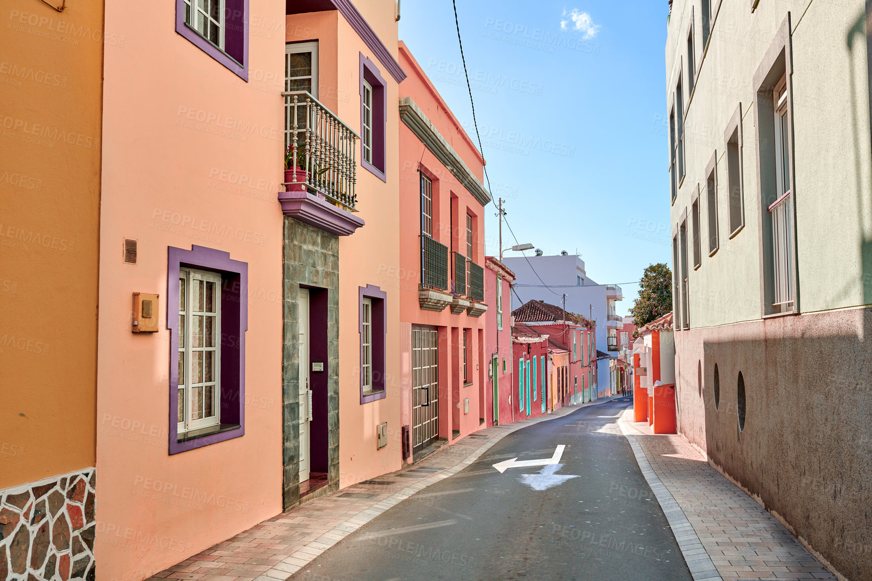 Buy stock photo Historical city street view of residential houses in small and narrow alley or road in tropical Santa Cruz, La Palma. Village view of vibrant buildings in popular tourism destinations overseas