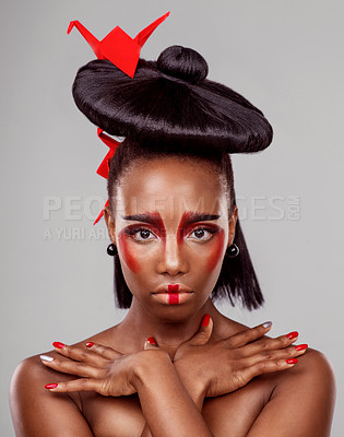 Buy stock photo Creative beauty, portrait and black woman with origami in studio by dark background for art deco. Serious face, makeup and skincare with African female, traditional and Japanese paper for cosmetics