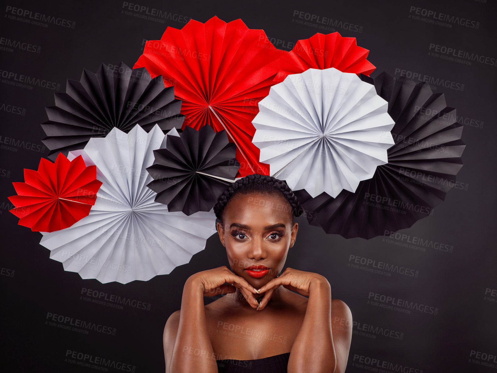 Buy stock photo Portrait, makeup and black woman with origami fans in studio isolated on a dark background. Serious face, beauty cosmetics and skincare of female model with traditional Japanese paper art for culture