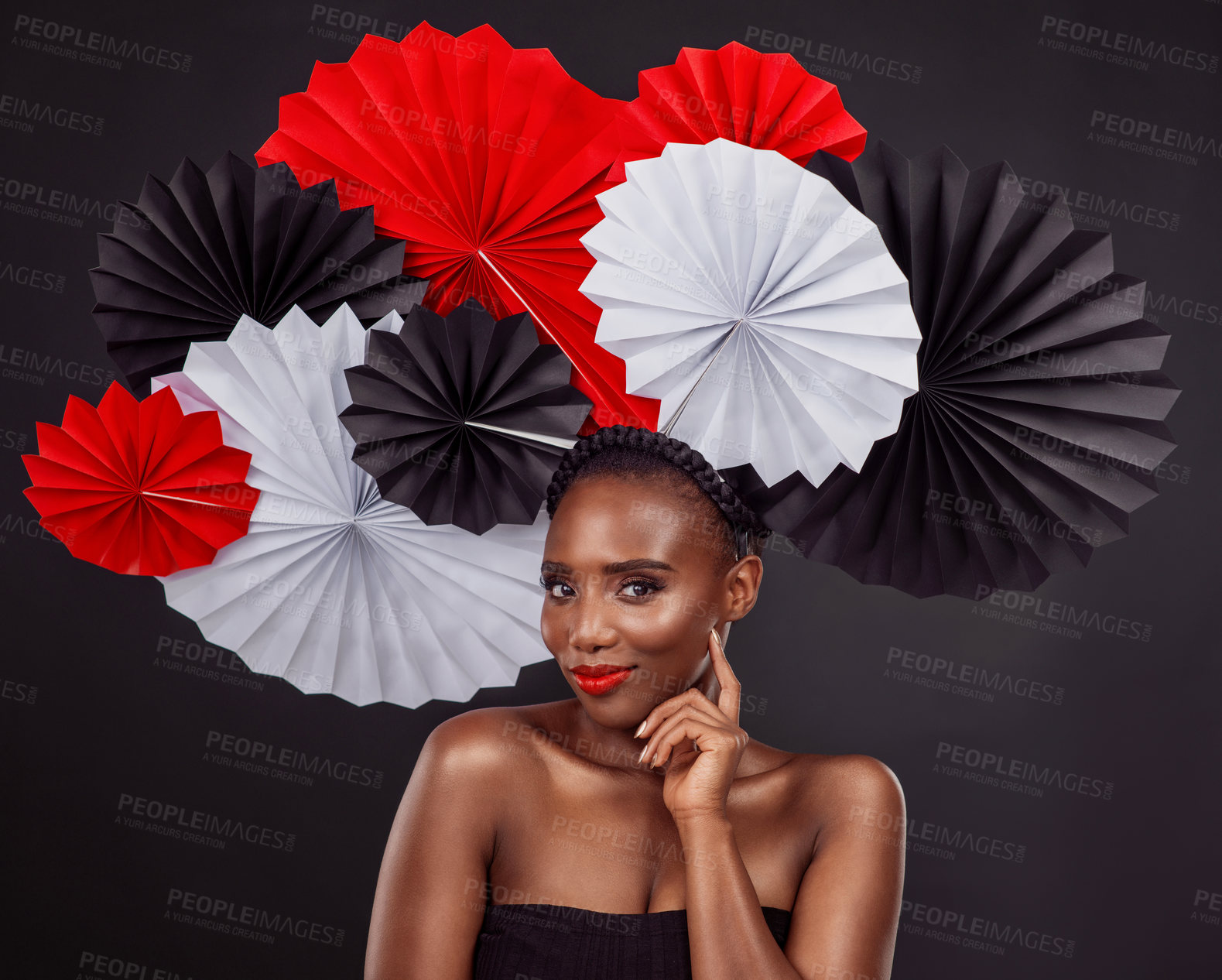 Buy stock photo Face, beauty and black woman with origami fans in studio isolated on a dark background. Portrait, makeup cosmetics and skincare of female model with traditional Japanese paper art for fashion hat.