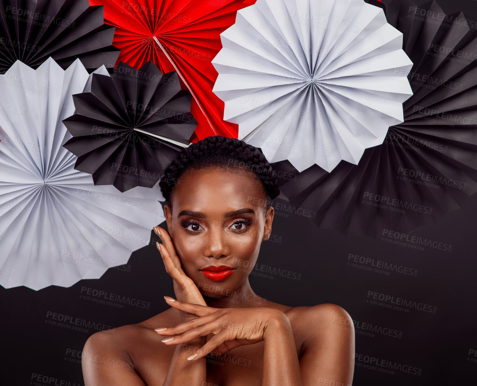 Buy stock photo Origami fans, portrait and a black woman with art for culture isolated on a black background. Creative, makeup and an African model with Japanese traditional art, paper or craft on a studio backdrop