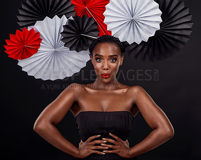 Buy stock photo Face, beauty and black woman with origami fans in studio isolated on a dark background. Portrait, makeup cosmetics and skincare of female model with traditional Japanese paper hat for fashion art.