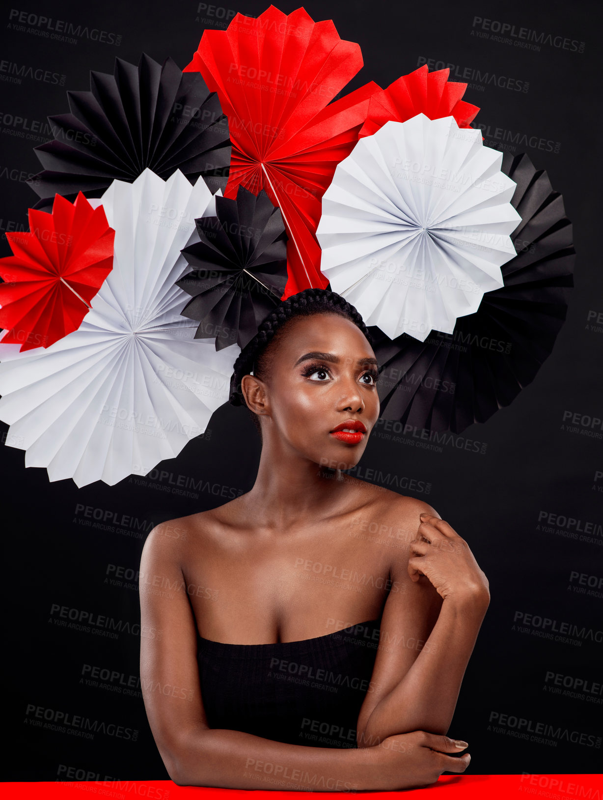 Buy stock photo African, female person and origami on hair in dark, studio and background for fashion with style, art and decor. Woman, makeup and glamour for creativity, beauty or design with pride or confidence
