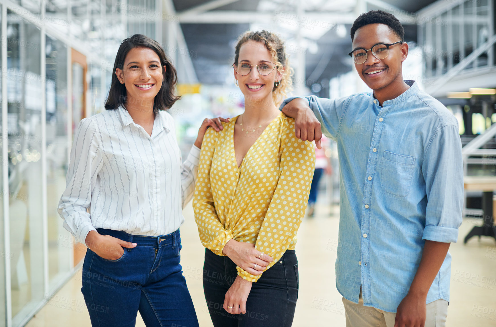 Buy stock photo Portrait of a group of confident young businesspeople working together in a modern office