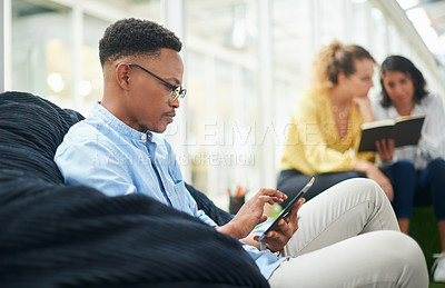 Buy stock photo Business man, phone and bean bag in office for creative agency, communication and relaxed workspace. Ui designer, smartphone and mobile app in workplace for tech company, media and website update